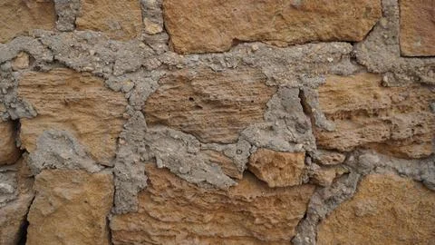 A Rough Stone Wall Texture With Cement Mortar for Building Design 写真素材