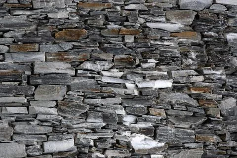 Rough stone wall for use as a background texture 库存照片