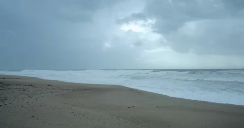 Rough stormy waves on beach. Cold day in winter with grey stormy sky Stock Footage 119801628