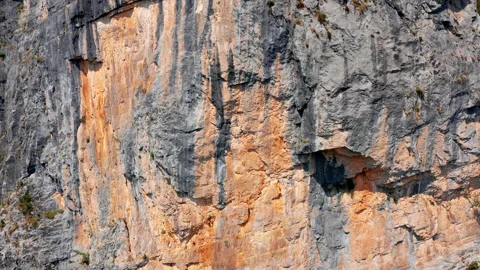 Rough surface and texture of rock on a vertical cliff. Geological layers Stock Footage 159770286