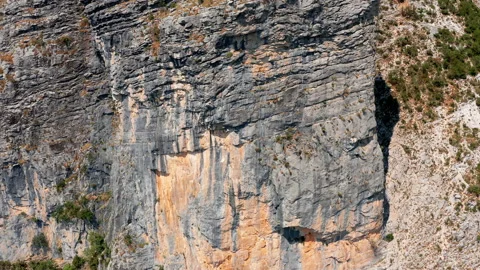 Rough surface and texture of rock on a vertical cliff. Geological layers Stock Footage 159772258