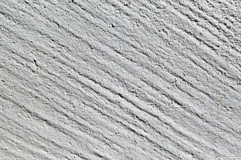 Rough surface of concrete wall with diagonal strips. Stock Photos