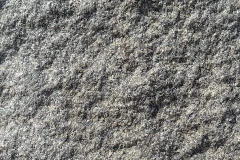 The rough surface of a granite piece of stone. Stock Photos