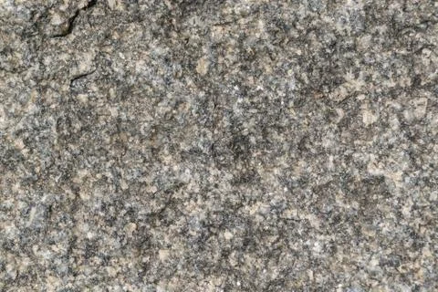 The rough surface of a granite piece of stone. Stock Photos