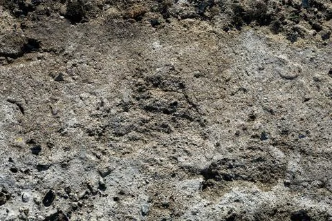 Rough surface of old and damaged concrete with numerous cracks Stock-Fotos