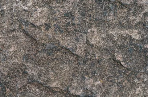 Rough surface old wall, fine granite stone mixed with biton mortar, textured  Stock Photos