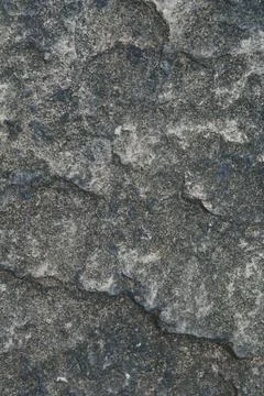 Rough surface old wall, fine granite stone mixed with biton mortar, textured  Stock Photos