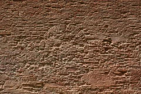 The rough surface of an old wall reveals intricate patterns and textures, s.. Stock Photos