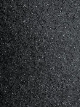 Rough texture of black stone surface Stock Photos