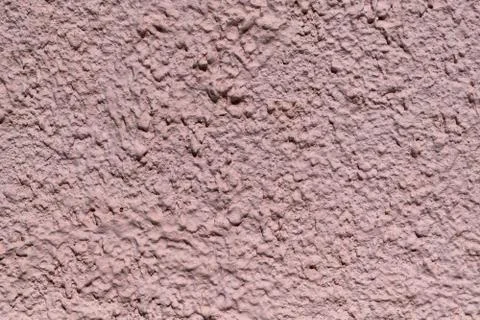 The rough texture of the decorative plaster on the wall. Stock Photos