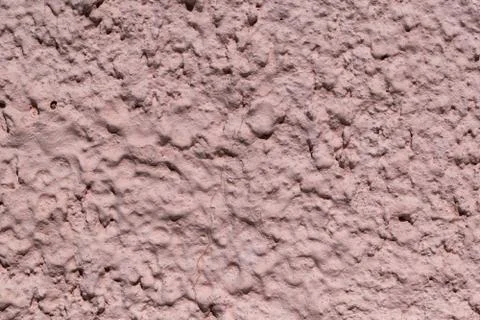 The rough texture of the decorative plaster on the wall. Stock Photos