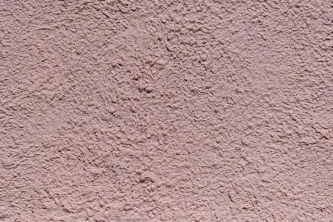 The rough texture of the decorative plaster on the wall. Stock Photos