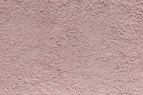 The rough texture of the decorative plaster on the wall. Stock Photos