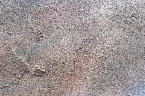 Rough texture of a fragment of an old wall painted with brown oil paint Stock Photos