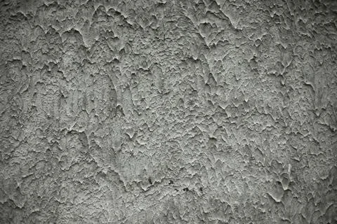 Rough texture of wall. Testurated paint on wall. Grey background. Stock Photos