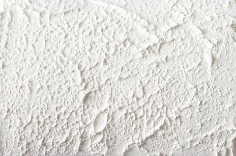 Rough texture of white putty on a wall Stock Photos