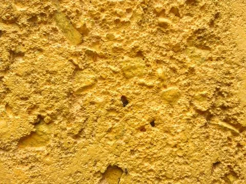 Rough texture of yellow painted wall surface Stock Photos
