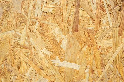 Rough texture of yellow pressed chipboard as background Stock Photos