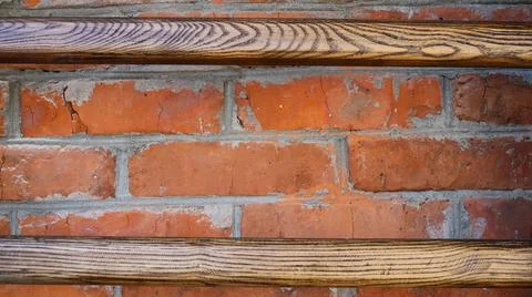 Rough textured background made of bricks and wood Stock Photos
