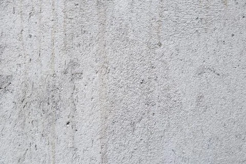 Rough textured light gray cement stucco wall background Stock Photos