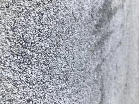 Rough textured plaster wall, blank, and long as a background Stock Photos
