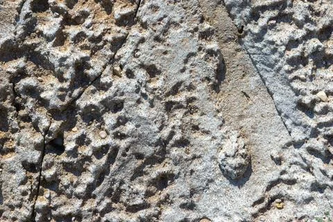 Rough textured rock surface with natural cracks Stock Photos