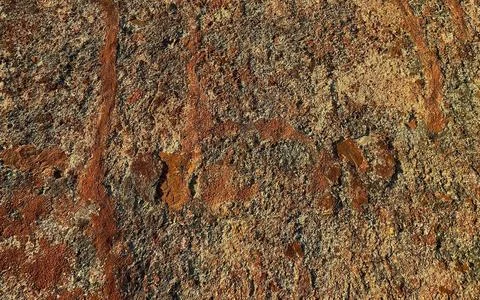 Rough Textured Stone Surface with Streaks of Reddish Brown and Sandy Beige .. Stock Photos