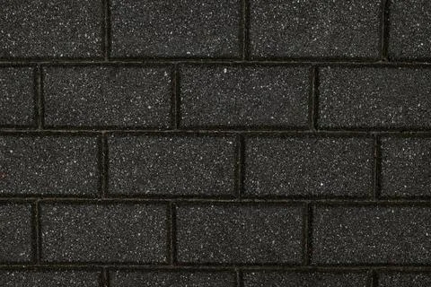 Rough textured surface of gray rectangular paving slabs, close up. 스톡 사진