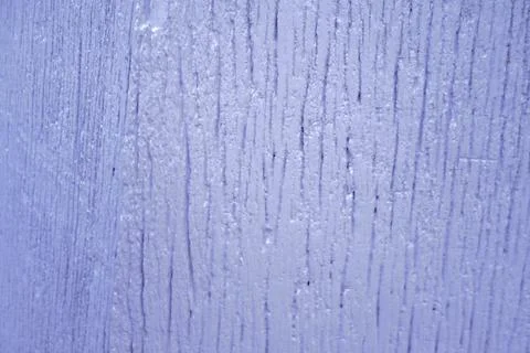 Rough textured surface with vertical grooves and a pale purple hue Stock Photos