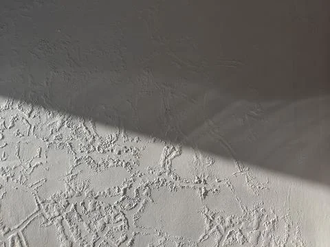 Rough Textured Wall Surface with Diagonal Shadows Stock Photos