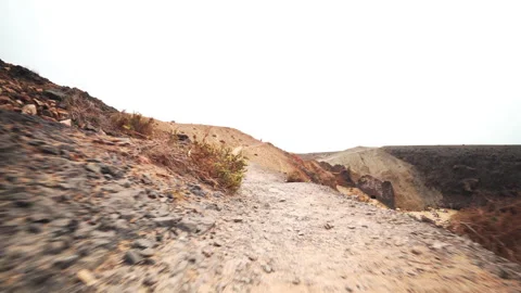 Rough volcanic cliffs on remote island coast Stock Footage 318783928