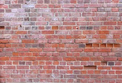 Rough wall background of red brick Stock Photos
