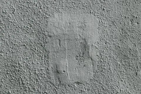 Rough wall covered with plaster and painted. Stock Photos