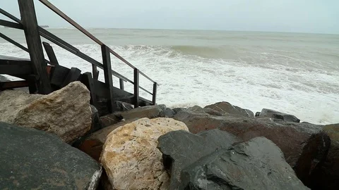 Rough waves on the beach. Cold cloudy day on the sea shore. Big stormy waves Stock Footage 91446189