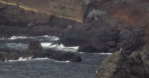 Rough waves breaking over rocks, 4K slomo Stock Footage 245755802