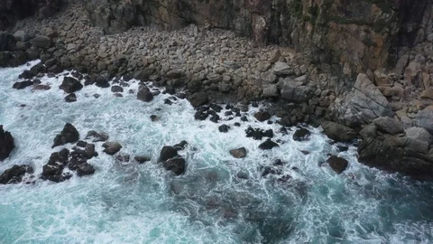 Rough Waves Crashing Over Rocks Aerial Drone Shot Stock Footage 122239528