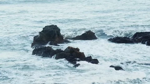 Rough Waves Crashing on Volcanic Rocks of Iceland's Coast Stock Footage 320202442