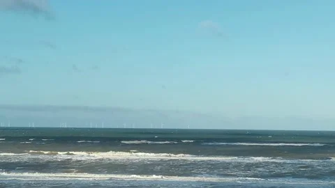 Rough waves of the North sea close to the beach with clear blue sky Stock Footage 196874347