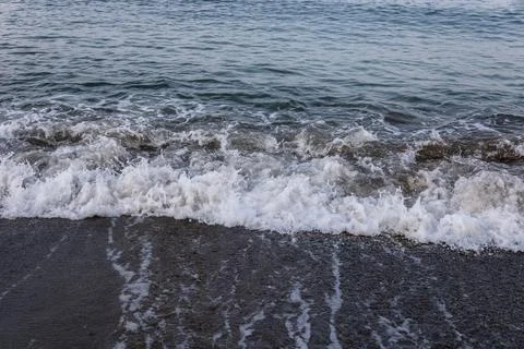 Rough waves on the seashore Stock Photos