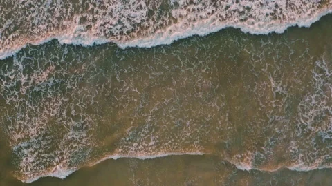 The rough waves turned red in the sunset. Stock Footage 138692365