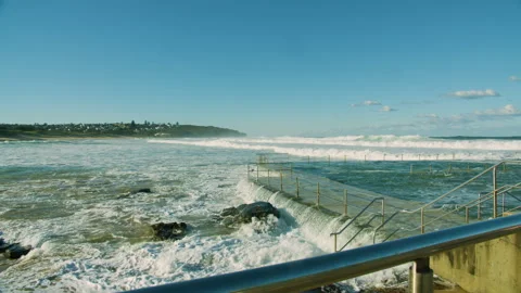 Rough Waves Washing Over a Public Pool at an Australian Beach Video stock 277633687