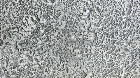  Rough weathered asphalt surface with intricate gray patterns and white m.. Stock Photos