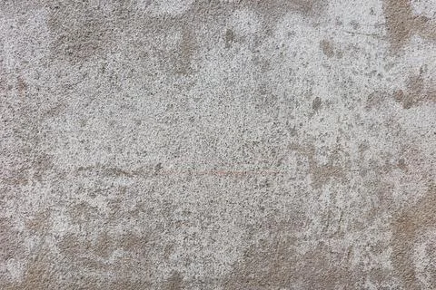 Rough white background of cement wall outside old building. Stock Photos