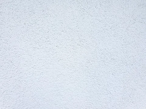 Rough white stucco wall texture background . Decorative plaster on wall. Stock Photos
