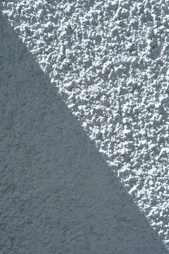 Rough White Stucco Wall Texture with Diagonal Shadow. Stock Photos