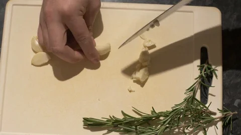 Roughly Dicing Fresh Garlic Cloves Stock Footage 85196487