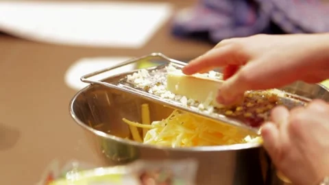 Roughly grate cheese in slow motion Stock Footage 149118620