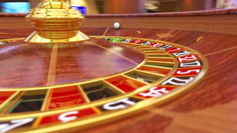 Roulette ball is rolling on the roulette wheel and gamblers bet for black or red Stock Footage 162725643
