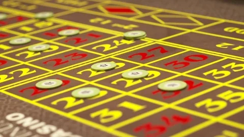 Roulette game board with bets Stockbeeldmateriaal 82930418