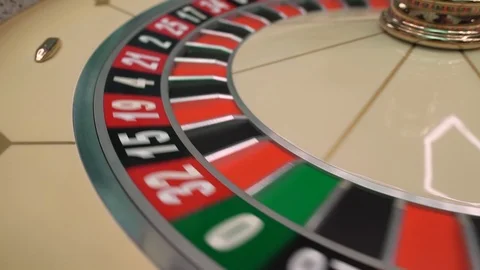 Roulette table in casino, with many games and slots, roulette wheel in the Video stock 107537232